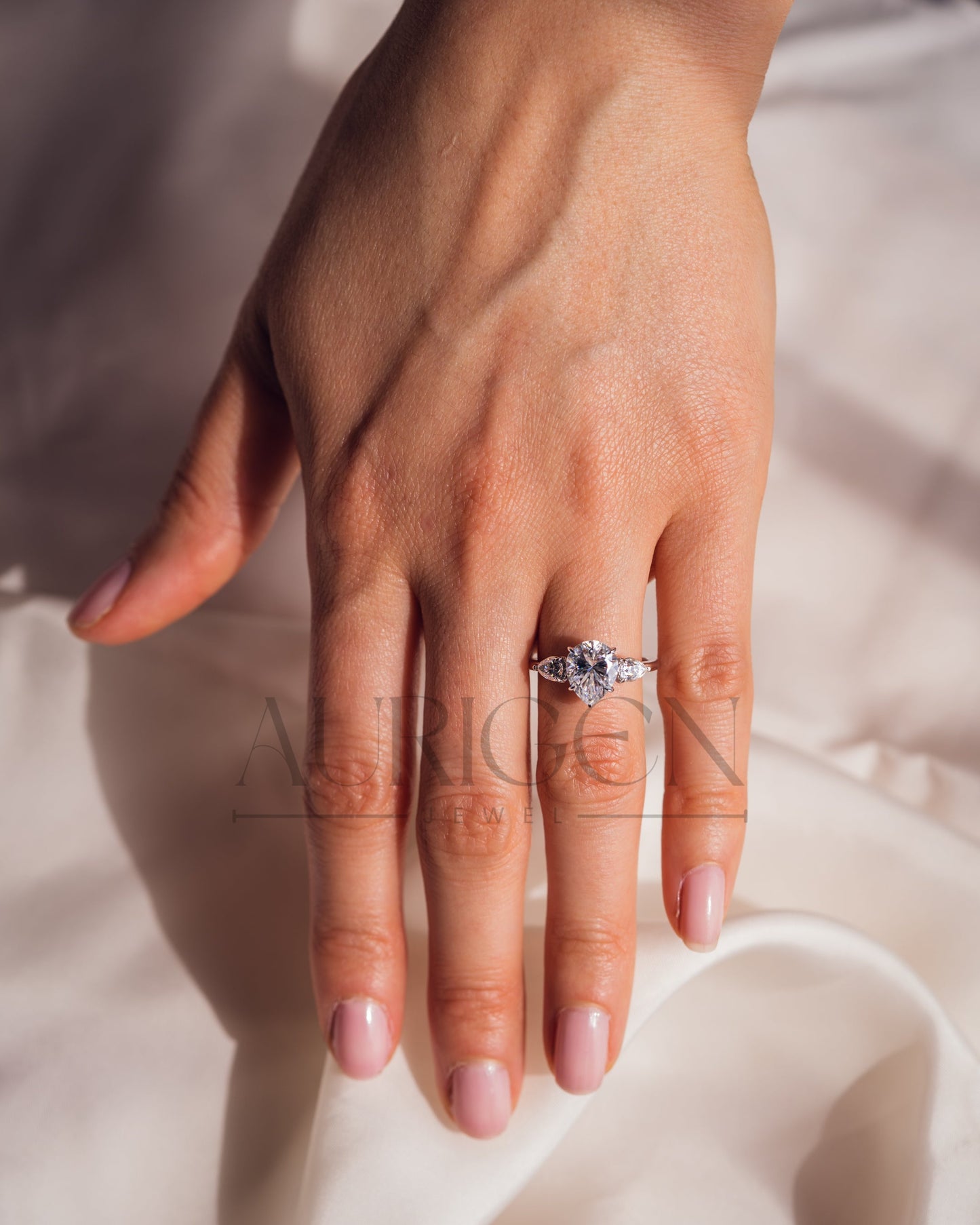 Brilliant Pear Cut Three-Stone Ring in 14k White Gold Moissanite and Lab Grown Diamond