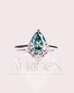 Stunning Teal Brilliant Pear Cut Moissanite and Lab Grown Engagement Ring with Halo