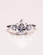 Brilliant Pear Cut Three-Stone Ring in 14k White Gold Moissanite and Lab Grown Diamond