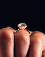 Modern Oval Cut Moissanite and Lab Grown Diamond Bezel Solitaire Ring in 14K Rose Gold